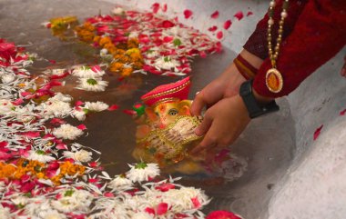 NEW DELHI INDIA SEPTEMBER 11 2024 Devotees seen immersing Idols of Hindu Lord Ganesh five day s at Delhi ka Maharaja go for ecofriendly Ganpati Visarjan during the 23rd Ganesh Mahotsav 2024 at Laxmi Nagar on September 11 2024 in New Delhi India The i clipart