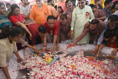 NEW DELHI INDIA SEPTEMBER 11 2024 Devotees seen immersing Idols of Hindu Lord Ganesh five day s at Delhi ka Maharaja go for ecofriendly Ganpati Visarjan during the 23rd Ganesh Mahotsav 2024 at Laxmi Nagar on September 11 2024 in New Delhi India The i clipart