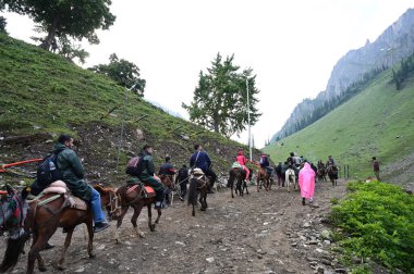 SRINAGAR INDIA JULY 1 2023 First batch of the Amarnath pilgrims on their way to the Amarnath cave on the Baltal route some 125 kilometers northeast of Srinagar on June 29 2023 in Srinagar India The 62 day pilgrimage which began on Saturday will under clipart