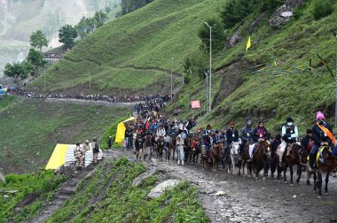 SRINAGAR INDIA JULY 1 2023 First batch of the Amarnath pilgrims on their way to the Amarnath cave on the Baltal route some 125 kilometers northeast of Srinagar on June 29 2023 in Srinagar India The 62 day pilgrimage which began on Saturday will under clipart