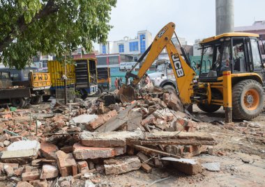 NEW DELHI INDIA JULY 2 2023 Demolition drive to remove a temple on road at Bhajanpura amid heavy security on July 2 2023 in New Delhi India A Hanuman temple and a Dargah were demolished at Bhajanpura Chowk in Delhi by the Public Works Department PWD  clipart