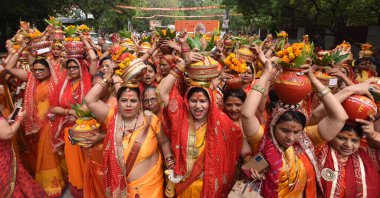 NEW DELHI INDIA JULY 5 2023 Thousands of women devotees participating in Kalash Yatra before Pandit Dhirendra Shastri Bageshwardham Hanuman Katha starting on Thursday at the festival ground IP extension on July 5 2023 in New Delhi India Photo by Sonu