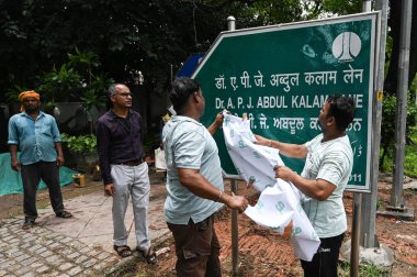 NEW DELHI INDIA JULY 6 2023 NDMC workers change the sign board after the name of Auranzeb lane is being renamed to APJ Abdul Kalam Lane on July 6 2023 in New Delhi India Photo by Sanchit Khanna Hindustan Times clipart