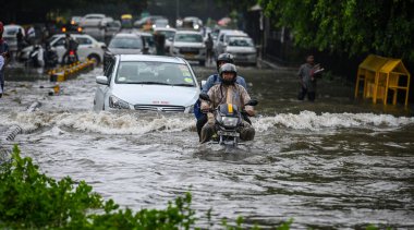 NEW DELHI INDIA JULY 8 2023 Traffic moves through a water logged street after the Heavy rains at Supreme Court of India on July 8 2023 in New Delhi India Delhi NCR was drenched with heavy rain on the intervening night of Friday and Saturday The overn clipart