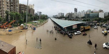 GURUGRAM INDIA JULY 9 2023 A view of heavily water logged street at Gurugram Sohna road at Subhash chowk near Celebration Mall on July 9 2023 in Gurugram India Delhi NCR was drenched with heavy rain on the intervening night of Friday Saturday and Sun clipart