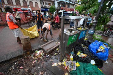 NEW DELHI INDIA - SEPTEMBER 12:  MCD workers seen cleaning the streets of Chandni Chowk  clipart