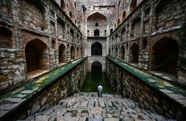 stock image NEW DELHI INDIA - SEPTEMBER 11:  Visitors enjoy at Historical landmark Ugrasen ki Baoli at Hailey Road near Connaught Place on September 11, 2024 in New Delhi, India 