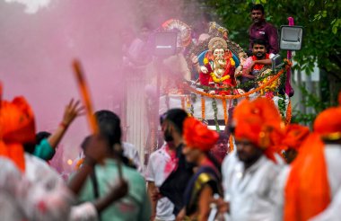 NEW DELHI INDIA SEPTEMBER 17 2024 Hindu Devotees chant as they carry a statue of the Hindu God Ganesha for immersion into water on the last day of the Ganesh Chaturthi festival at Firozshah Road on September 17 2024 in New Delhi India Photo by Raj K  clipart