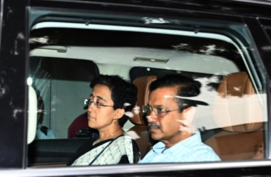 NEW DELHI, INDIA SEPTEMBER 17 ,2024 Delhi Chief Minister Arvind Kejriwal with Delhi CM designate Atishi arrives at the residence of Lt Governor Vinay Kumar Saxena after she was elected the Chief Minister designate by the AAP party and Arvind Kejriwal clipart