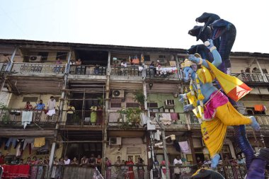 MUMBAI INDIA SEPTEMBER 17 2024 Devotees take Ganpati idol of Lord Ganesha for immersion at Khetwadi on September 17 ,2024 in Mumbai ,India clipart