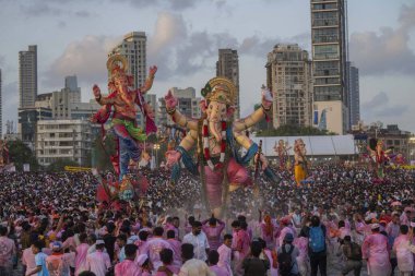 MUMBAI INDIA SEPTEMBER 17 2024 the ceremonies for immersion of ganesh idols progressed peacefully where lakhs of devotees come out on the streets to bid adieu to ganpati at Girgaon chowpatty on September 17, 2024 in Mumbai, India  clipart