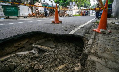 NEW DELHI INDIA JULY 11 2023 A part of the road gets caved in after Rains at Harish Chander Mathur Lane NDMC Area on July 11 2023 in New Delhi India Several parts of northwest India witnessed a heavy spell of rain breaking a 40 year old record It rec clipart