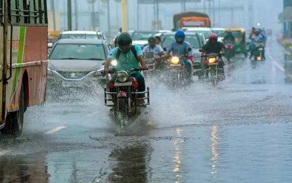 stock image GHAZIABAD INDIA JULY 10 2023 Commuters wade through a water logged road at Dasna National Highway on July 10 2023 in Ghaziabad India Several parts of northwest India witnessed a heavy spell of rain breaking a 40 year old record It recorded 153 mm of 