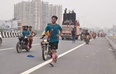 GHAZIABAD INDIA JULY 15 2023 Thousands of Dak Kanwars throng at Delhi Meerut Expressway on the penultimate day of Kanwar yatra on July 15 2023 in Ghaziabad India Photo by Sakib Ali Hindustan Times clipart