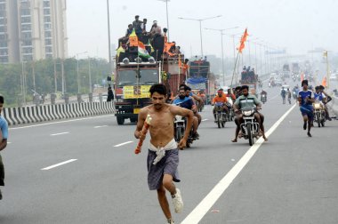 GHAZIABAD INDIA JULY 15 2023 Thousands of Dak Kanwars throng at Delhi Meerut Expressway on the penultimate day of Kanwar yatra on July 15 2023 in Ghaziabad India Photo by Sakib Ali Hindustan Times clipart