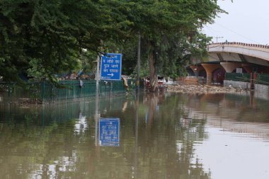 NEW DELHI INDIA JULY 15 2023 Flood waterlogged near Hanuman Mandir opposite Yamuna Bazar on July 15 2023 in New Delhi India The water level of the river has been rising since Wednesday after it breached an all time high mark in more than 45 years Aut clipart