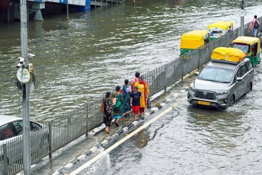 NEW DELHI INDIA JULY 16 2023 Commuters move through the floodwaters of the swollen Yamuna river at ITO on July 16 2023 in New Delhi India The water level of the river has been rising since Wednesday after it breached an all time high mark in more tha clipart