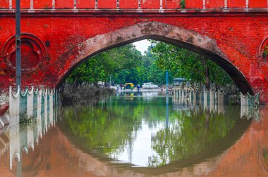 NEW DELHI INDIA JULY 16 2023 A view of a flood water logged street near Salimgarh Fort back side of Red Fort in the morning on July 16 2023 in New Delhi India The water level of the river has been rising since Wednesday after it breached an all time  clipart