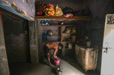 NEW DELHI INDIA JULY 17 2023 Locals and residents of Yamuna Bazaar area seen clearing the silt deposited in their houses after the Yamuna River levels gets lowered on July 17 2023 in New Delhi India Photo by Sanchit Khanna Hindustan Times clipart