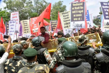 PATNA INDIA JULY 17 2023 Police personnel stopping rally of All India Students Association AISAduring their Raj Bhawan march against new education policy and other various demands near JP roundabout on July 17 2023 in Patna India Photo by Santosh Kum clipart