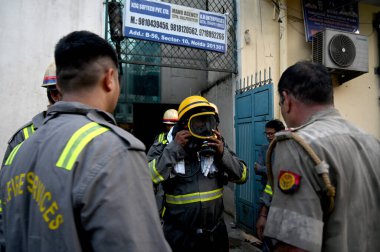 NOIDA INDIA JULY 18 2023 Fire department team reached to extinguish the fire in a garment export company in Sector 10 on July 18 2023 in Noida India Photo by Sunil Ghosh Hindustan Times clipart