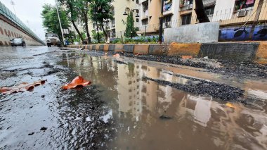 MUMBAI INDIA JULY 18 2023 Potholes appear after heavy rainfall at navghar circle mulund on July 18 2023 in Mumbai India Photo by Praful Gangurde Hindustan Times clipart