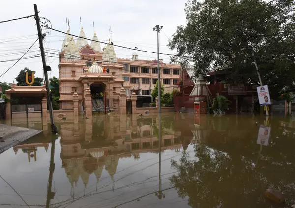 stock image NEW DELHI INDIA JULY 15 2023 A flooded road outside Shri Swaminarayan Mandir as the swollen Yamuna river inundates nearby areas at Civil Lines on July 15 2023 in New Delhi India The water level of the river has been rising since Wednesday after it br