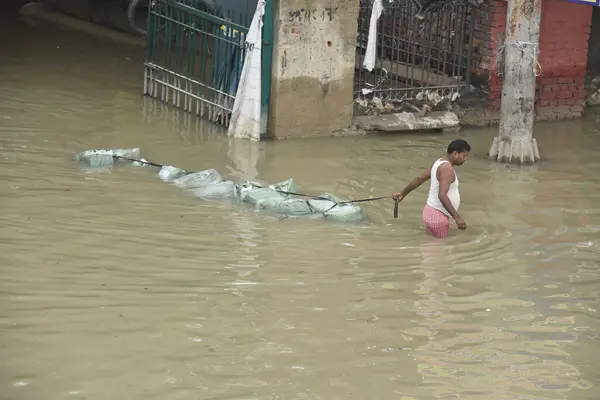 stock image NEW DELHI INDIA JULY 15 2023 A view of flooded road behind the Red Fort as the swollen Yamuna river inundates nearby areas Near Hanuman Temple on July 15 2023 in New Delhi India The water level of the river has been rising since Wednesday after it br