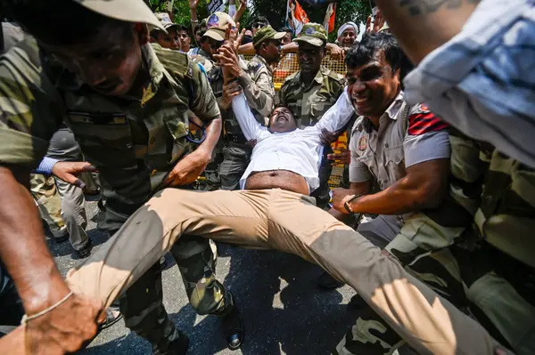 stock image NEW DELHI INDIA JULY 20 2023 A member of the Indian Youth Congress is detained by policemen during a protest over sexual violence against women and for peace in the ongoing ethnic violence in Indias north eastern state of Manipur at Raisina Road on J