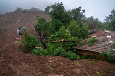 RAIGAD INDIA JULY 20 2023 Rescue operations are going on where people trapped under rubble after landslide in Khalapur Irshalwadi Village on July 20 2023 in Raigad India At least 16 people were killed when a massive landslide struck a remote hilly tr clipart