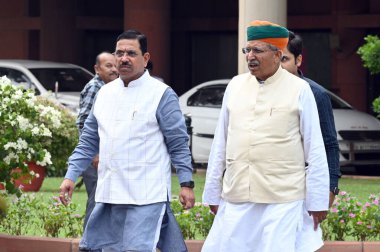 NEW DELHI INDIA JULY 21 2023 Parliamentary Affairs Minister Pralhad Joshi and Arjun Ram Meghwal at Parliament House during the Parliament monsoon session on July 21 2023 in New Delhi India Parliament proceedings continued to be drowned in protests re clipart