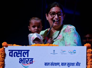 MUMBAI, INDIA, JULY 22 , 2023 Union Minister for Women and Child Development and Minority Affairs Smriti Irani shared light moment with parents and their children during Vatsal Bharat Regional Symposium on Child Protection  clipart