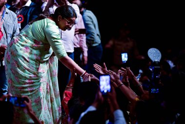 MUMBAI, INDIA, JULY 22 , 2023 Union Minister for Women and Child Development and Minority Affairs Smriti Irani shared light moment with parents and their children during Vatsal Bharat Regional Symposium on Child Protection  clipart