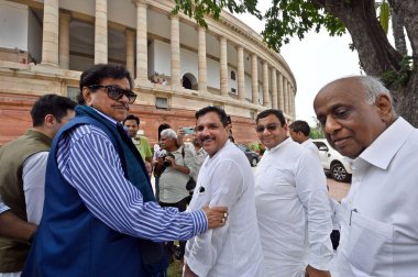 NEW DELHI INDIA JULY 25 2023 TMC MP Shatrughan Sinha with AAP MPs Sanjay Singh Raghav Chadha and Sushil Gupta Rinteracts with the media during opposition MPs protest demanding Prime Minister Narendra Modis statement on the ongoing crisis in Manipur a clipart