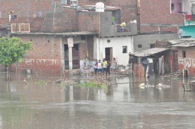 GHAZIABAD INDIA JULY 26 2023 Many houses constructed on floodplains of river Hindon Chijarsi have inundated due to high water discharge on Wednesday on July 26 2023 in Ghaziabad India Photo by Sakib Ali Hindustan Times clipart