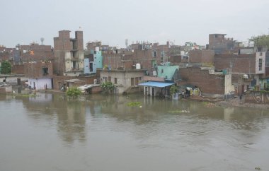 GHAZIABAD INDIA JULY 26 2023 Many houses constructed on floodplains of river Hindon Chijarsi have inundated due to high water discharge on Wednesday on July 26 2023 in Ghaziabad India Photo by Sakib Ali Hindustan Times clipart