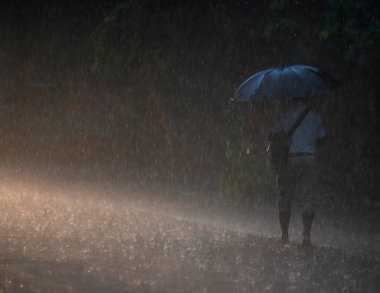 NOIDA INDIA JULY 26 2023 Commuters seen out during heavy rain in Sector 12 road on July 26 2023 in Noida India The residents of Delhi NCR witnessed heavy rainfall Commuters faced problems due to waterlogging in several areas The IMD predicted moderat clipart