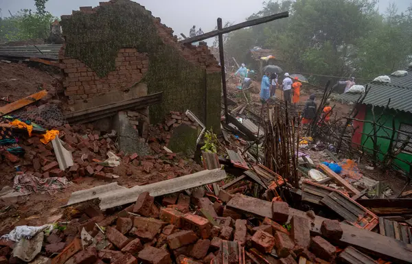 stock image RAIGAD INDIA JULY 21 2023 Rescue operations are going on the second day where people are trapped under rubble after a landslide in Khalapur Irshalwadi Village on July 21 2023 in Raigad India At least 16 people died and over 100 are feared trapped und