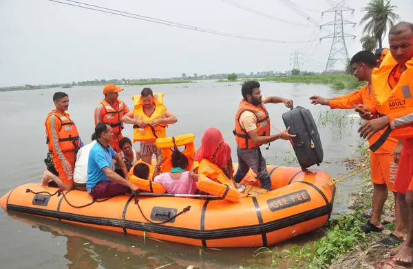 Stock image GHAZIABAD INDIA JULY 21 2023 NDRF Personnel rescued residents from the flooded Atour village area when the water level of the Hindon river increased on July 21 2023 in Ghaziabad India Photo by Sakib Ali Hindustan Times