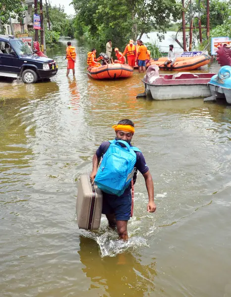 stock image Ghaziabad India July 242023 2023 People seen coming out from the flooded waters along with their household items after the water from Hindon river enters the areas of Karhera in Sahibabad Ghaziabad on July 24 2023 in Ghaziabad India Photo by Sakib Al