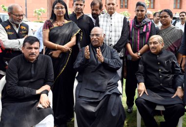 NEW DELHI INDIA JULY 27 2023 AAP MP Sanjay Singh with Leader of Opposition in Rajya Sabha Mallikarjun Kharge and other opposition MPs during a protest over his suspension from Rajya Sabha at Parliament House complex amid the Monsoon session on July 2 clipart