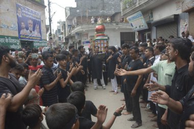 GHAZIABAD INDIA JULY 29 2023 Shia Muslims participate in a Muharram procession at Ward number 4 in Dasna on July 29 2023 in Ghaziabad India Ashura mourns the death of Imam Hussein a grandson of the Prophet Muhammed who was killed by armies of the Yaz clipart