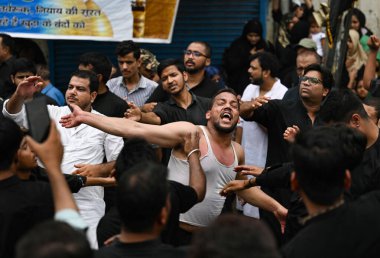 NEW DELHI INDIA JULY 29 2023 Shia Muslims participate in a Muharram procession at Shia Jamam Masjid in Kashmiri Gate on July 29 2023 in New Delhi India Ashura mourns the death of Imam Hussein a grandson of the Prophet Muhammed who was killed by armie clipart