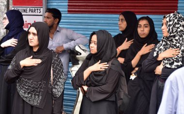 NEW DELHI INDIA JULY 29 2023 Muslim devotees take part in a mourning procession marking the day of Ashura 10 Muharram ul Haram at Shia Jama Masjid Kashmiri Gate on July 29 2023 in New Delhi India Ashura mourns the death of Imam Hussein a grandson of  clipart