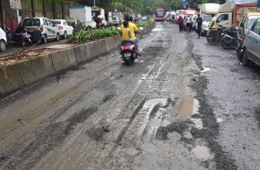 MUMBAI INDIA JULY 29 2023 A worker fell down the pothole at Dhobi Ghat Capt Prakash Pethe Marg Cuffe Parade on July 29 2023 in Mumbai India Photo by Bhushan Koyande Hindustan Times clipart