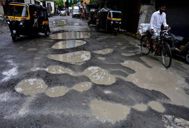 MUMBAI INDIA JULY 29 2023 A Huge Pothole seen on Veera Desai Cross Road and This road are repaired Before Raine Monsoon at Andheri West on July 29 2023 in Mumbai India Photo by Vijay Bate Hindustan Times clipart