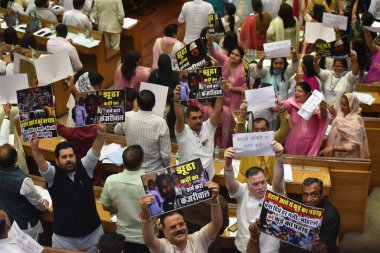 NEW DELHI INDIA JULY 31 2023 All the BJP councilors including BJP leader of opposition started sloganeering in Val with posters in their hands against Kejiriwal during the the House meeting of Municipal Corporation of Delhi at Civic Centre on July 31 clipart