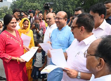 NEW DELHI INDIA SEPTEMBER 23 2024 Delhi BJP President Virendra Sachdeva & LOP assembly Vijender Gupta along with MLAs launch the Janta Ka Mudda Assembly Mein Campaign at outside Palika Market in Connaught Place on September 23 2024 in New Delhi India clipart