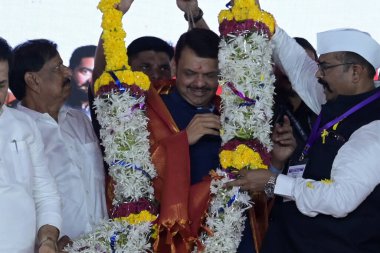 NAVI MUMBAI INDIA SEPTEMBER 25 2024 Maharashtra Dy CM Devendra Fadnavis during 91th Birth Anniversary of Late Mathadi Leader Annasaheb Patil held at APMC Onion Potato Market Vashi on September 25 2024 in Navi Mumbai India On the 91st birth anniversar clipart