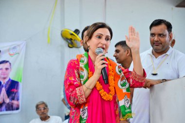 GURUGRAM, INDIA, SEPTEMBER 26, 2024 Juhi Babbar, daughter of film actor and former Congress MP Raj Babbar campaigns for Congress candidate Vardhan Yadav from Badshahpur assembly constituency on September 26 2024  clipart